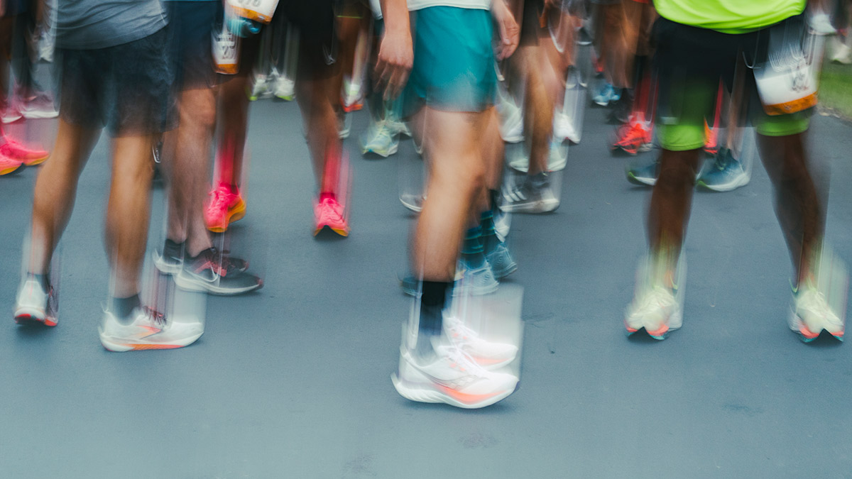 Why Can’t I Sleep After A Marathon? Image Of A Group Of Marathon Runners' Feet Blurred Emoting The Problem Of Sleeping After A Marathon