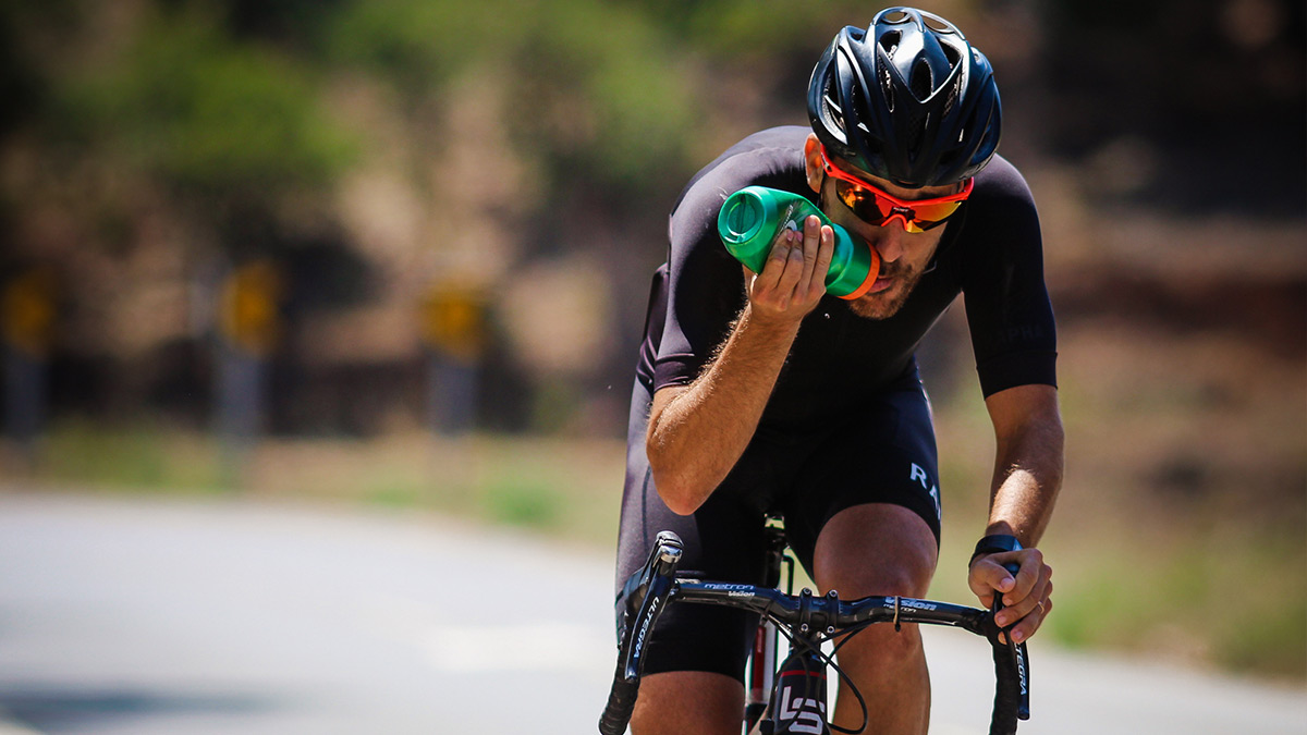 Periodization Training Is Key To Optimal Performance And Recovery Image Of A Male Cyclist On Bicycle Drinking Water During Periodization Training