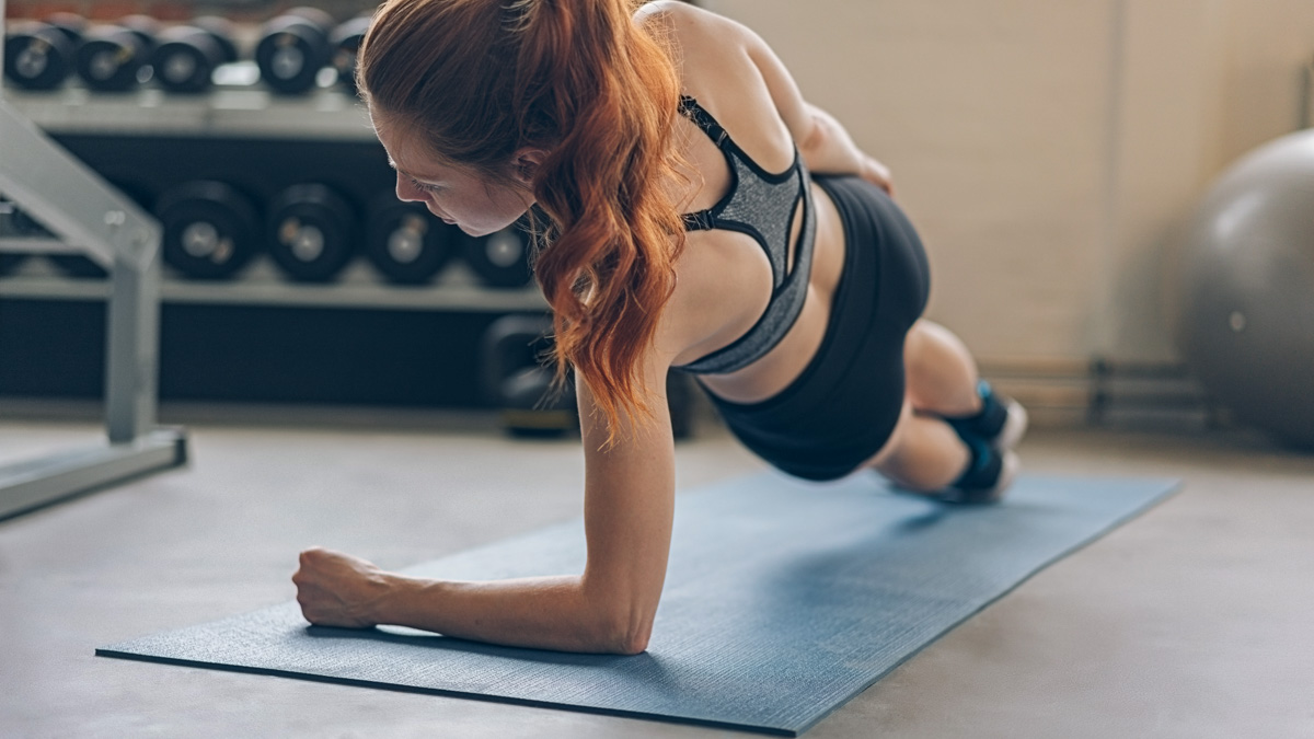 Woman Executing A Side Plank Woman Executing A Side Plank