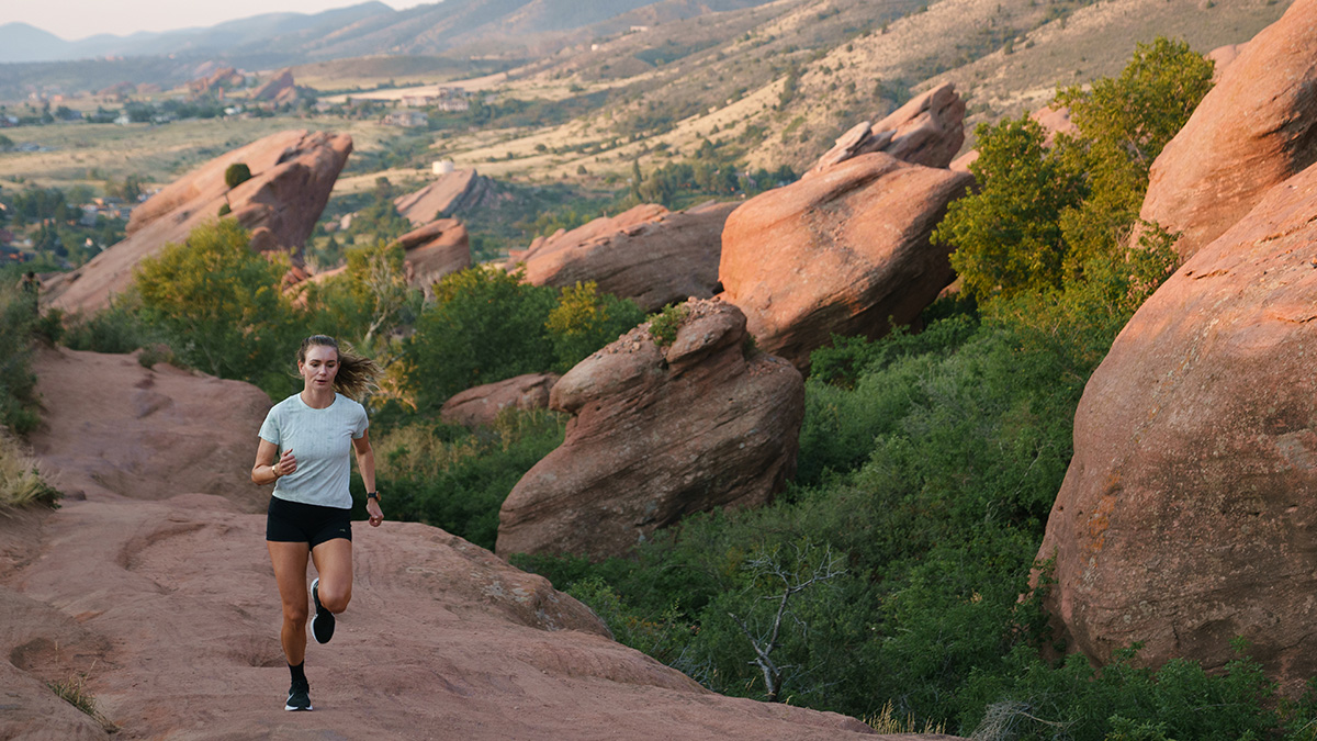 Woman Running On Trail