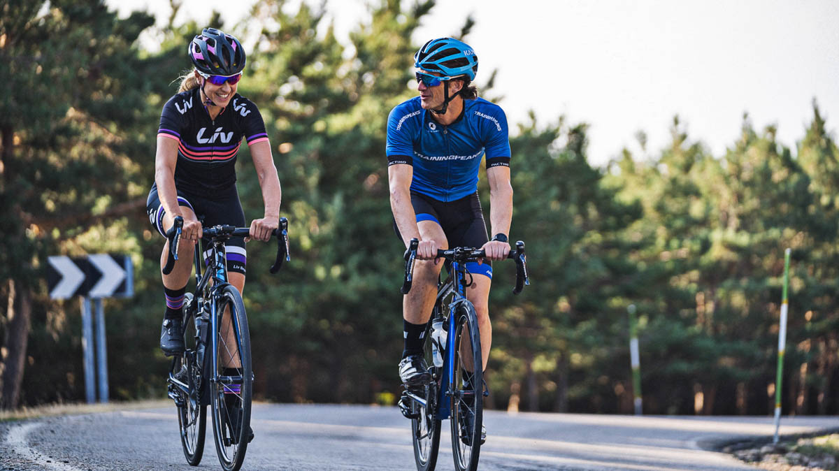 Understanding Menstruation Performance Female Athletes A Male Cycling Coach Riding With A Female Athlete On A Road
